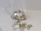a bag full of coins sitting on a table