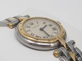 a close up of a wrist watch on a white surface