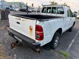 a white pick up truck that is parked in a parking lot