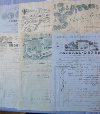 some old papers are sitting on a table with a blue table cloth