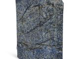 a blue stone sculpture on a white surface