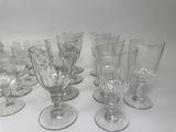 a lot of empty wine glasses sitting on a table