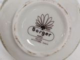 a close up of a plate with a flower on it