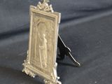 a silver picture frame with a picture of a woman on it