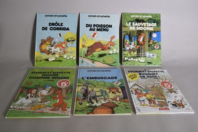 plusieurs livres pour enfants sont alignés sur une surface blanche