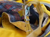 a close up of a fireman ' s helmet with a yellow jacket