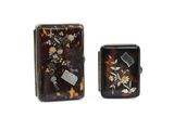 pair of small tortoise shell boxes with flowers and leaves on them