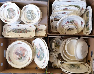plusieurs assiettes et bols dans une boîte posée sur le sol