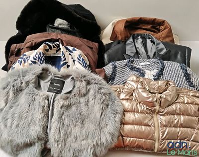 a pile of jackets and jackets sitting on a table
