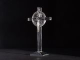 the cross is made of clear glass with a black background