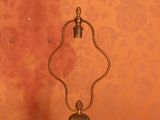 a lamp that is sitting on a table in front of a wall