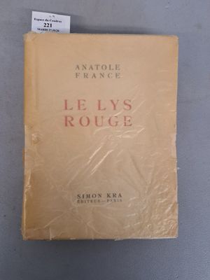 an old book sitting on top of a table next to a cup of coffee