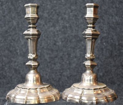 two candles that are sitting on a table