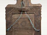 an old wooden picture frame with a rope hanging from it ' s side