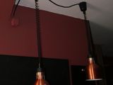 two lights hanging from the ceiling in a room