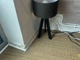 a lamp that is sitting on the floor next to a window