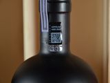 a bottle of wine that is sitting on a table