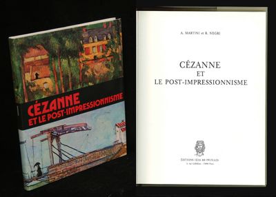two books sitting on a table next to each other on a black surface