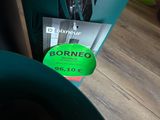 a green sign that says robmeco on the side of a table