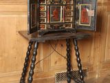 a small wooden table with a small cabinet on it