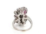 an image of a diamond and ruby ring on a white background