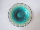 a glass bowl with a blue and white design on it