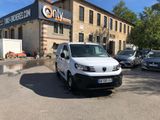 a white van that is parked in front of a building