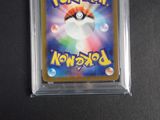 a close up of a pokemon trading card in a plastic holder