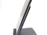 a cell phone that is sitting on top of a stand
