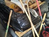 a pile of wood and tools in a garage