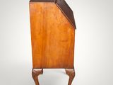 an old wooden cabinet with a brown top and legs