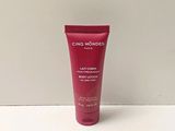a close up of a tube of body lotion on a table