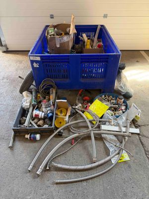 a blue crate with a bunch of tools in it