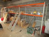 a room with a lot of shelves and tools in it