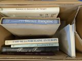 a box full of books sitting on top of a table