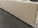 a couch that is sitting on the floor in a room