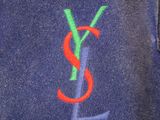 blue jacket with a red ysl logo on it