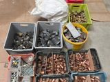 many different types of pipes and fittings on the floor