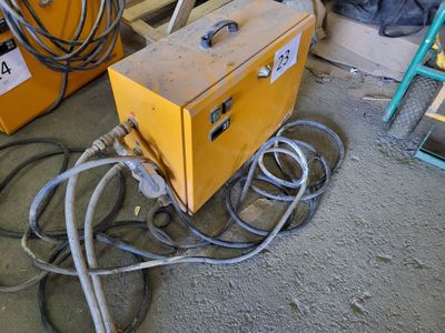 a machine that is sitting on the ground in the garage