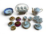 many cups and saucers that are sitting on the table