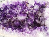 a close up picture of a purple crystal cluster