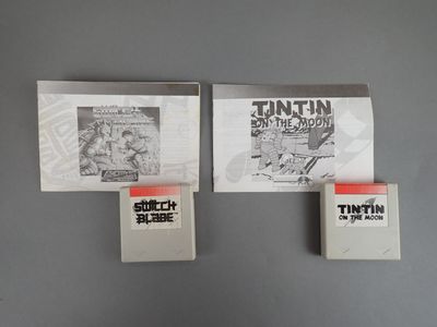 three books on a gray wall with a black and white photo