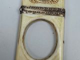 a ring that is sitting on top of a piece of ivory