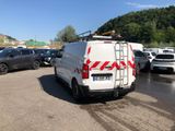 a white van that is parked in a parking lot