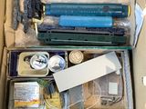 a box full of assorted items sitting on a table