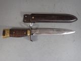 two knives that are sitting next to each other on a table