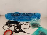the contents of a carburettor repair kit are laid out on the table