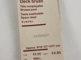 a tag that says repairable head deck brush on it