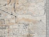 une vieille carte d'une ville avec une ligne rouge au milieu