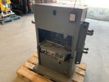 a machine that is sitting on a pallet in a garage